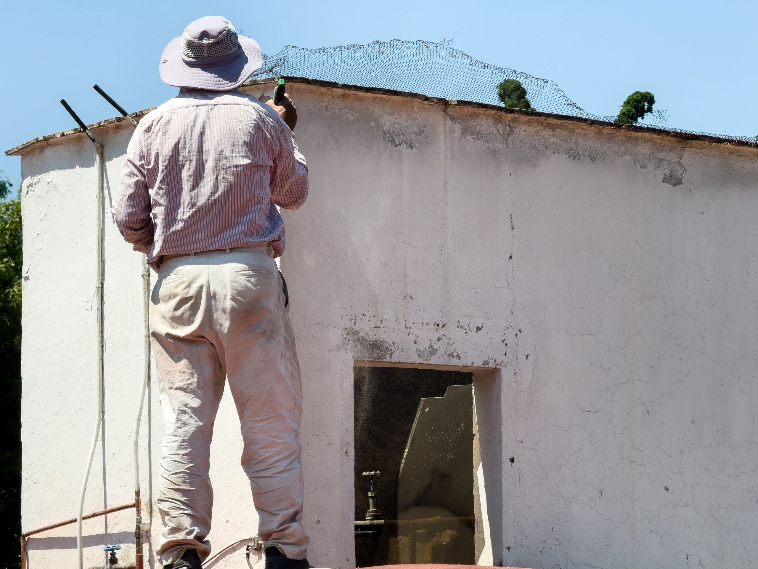 Technician working on rooftop access area