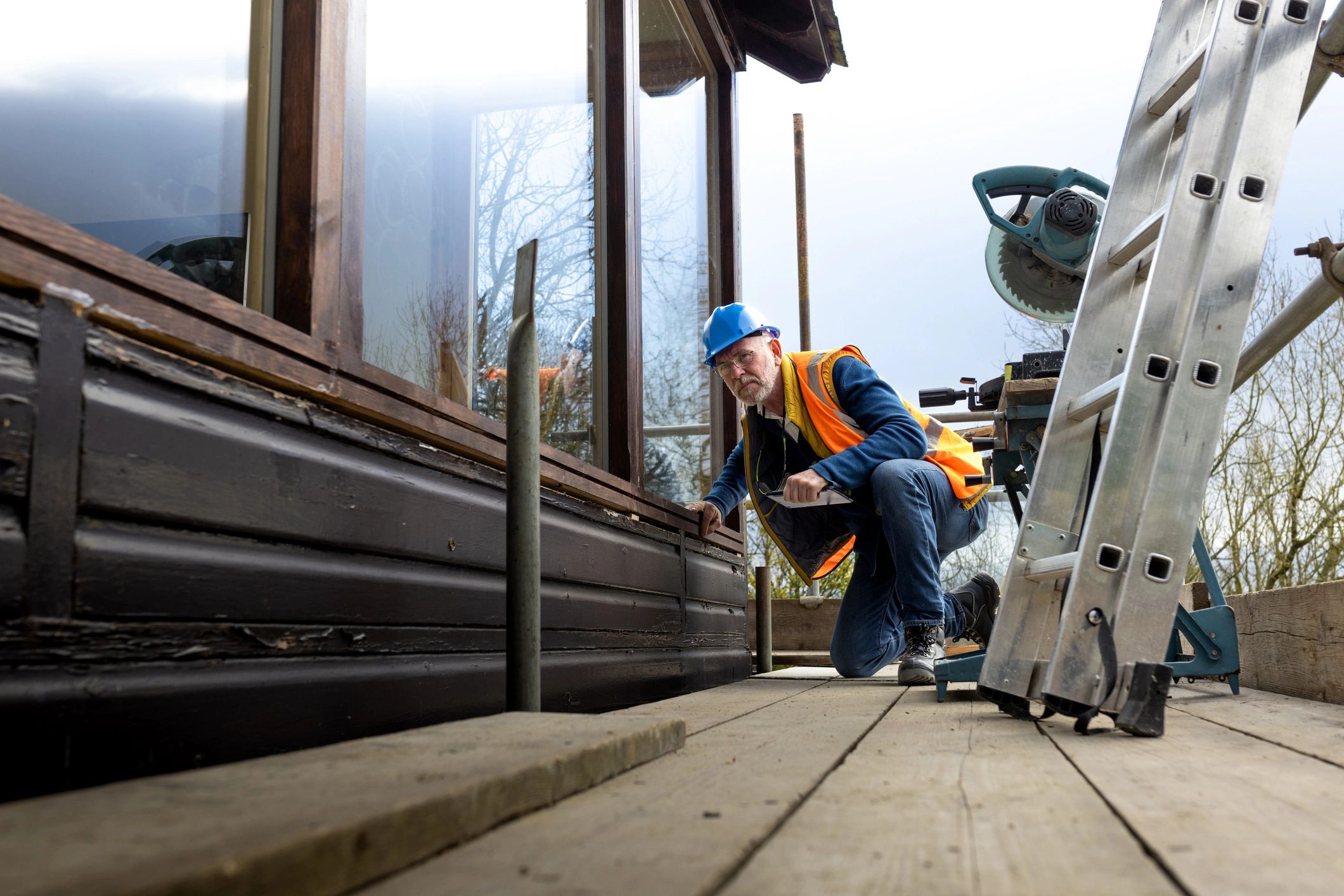 Technician inspecting exterior building details